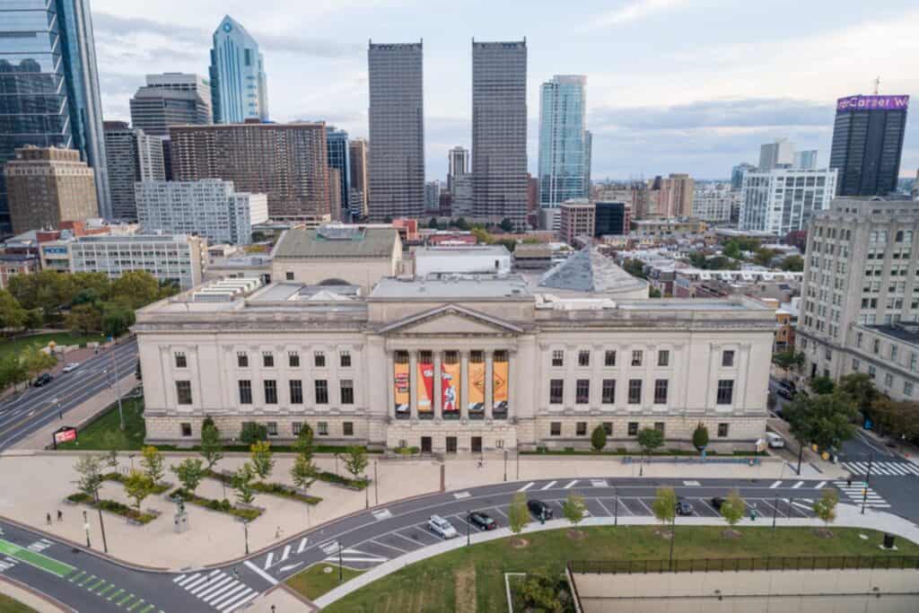Aerial view of a city with a historic building.