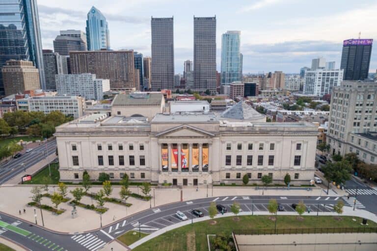 Aerial view of a city with a historic building.
