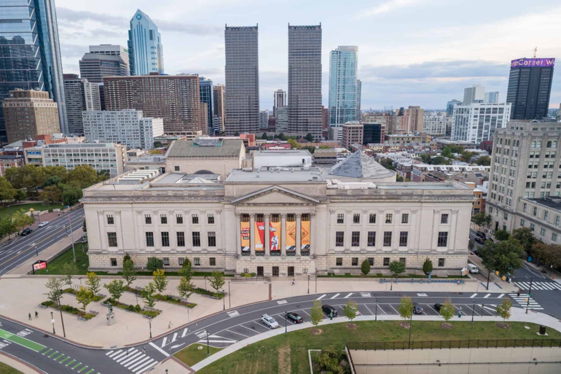 Aerial view of a city with a historic building.