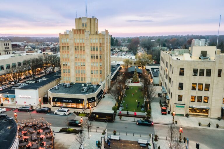 Aerial view of city street with Christmas tree.