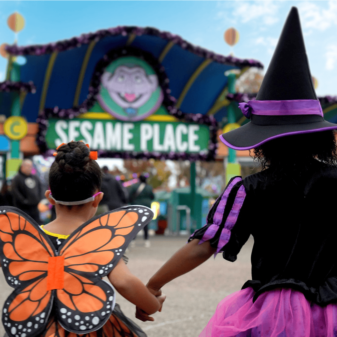 Children in Halloween costumes at Sesame Place Philadelphia for Spooktacular event.