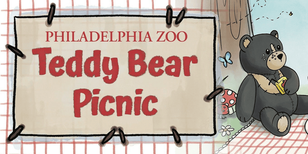 Cute teddy bear holding a book at the Teddy Bear Picnic event.